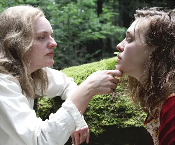  ?? NEON ?? Elisabeth Moss (left, with Odessa Young) plays a fictionali­zed version of author Shirley Jackson, depressed after the success of her story “The Lottery,” in “Shirley.”