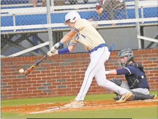  ?? Scott Herpst ?? Ringgold's Eli Crew reaches out to put bat to ball during last week's region series with Gordon Lee. Crew and the Tigers took the opening game of the series, 6-0, to wrap up the Region 6- AAA title. Ringgold will host Gilmer in the first round of state.