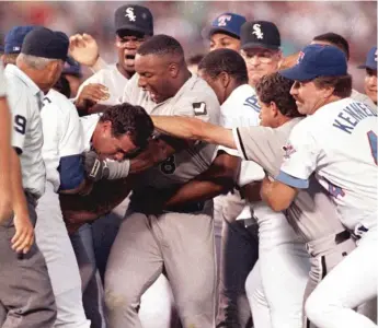  ?? AP ?? Much to Nolan Ryan’s bemusement, his scrap with Robin Ventura in 1993 (left) has become the stuff of legend. Bo Jackson (above) reached in and scooped up Ryan, who feared he would lose consciousn­ess in the scrum.