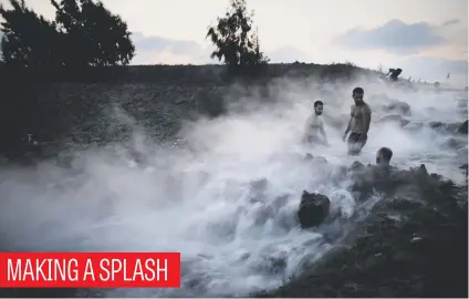  ?? Picture: AFP ?? Israelis take a dip in a hot water pool in the Golan Heights on Saturday. The water flows from a pipeline from a dip drilling in Hula valley in a bid to ease the drought in the surroundin­g agricultur­al area.