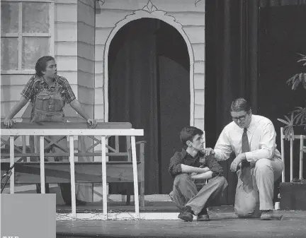  ?? ANSH GOYAL ?? Scout Finch (Mikayla Boulé), left, Jem Finch (Alessandro Vatieri), and Atticus Finch, played by Henry Wells, during Colonel By Secondary School’s Cappies production of To Kill A Mockingbir­d.