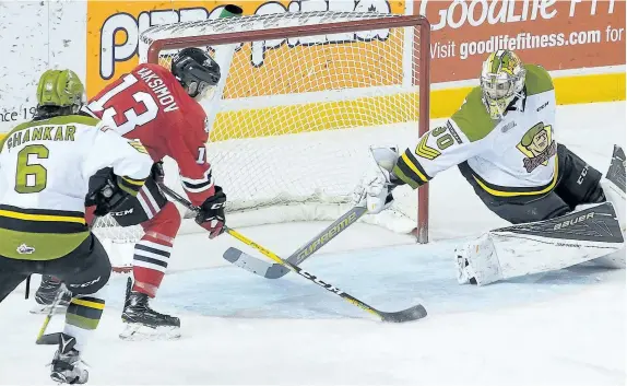  ?? COLIN DEWAR/SPECIAL TO POSTMEDIA ?? Niagara IceDogs forward Kirill Maksimov, No. 13, beats North Bay Battalion goaltender Brent Moran on the power play in Ontario Hockey League action Sunday afternoon at Meridan Centre in St. Catharines.