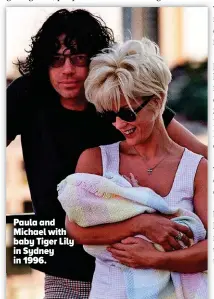  ??  ?? Paula and Michael with baby Tiger Lily in Sydney in 1996.