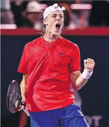  ?? MINAS PANAGIOTAK­IS/GETTY IMAGES ?? Canada’s Denis Shapovalov seized momentum in the second half of his match against Adrian Mannarino of France to win their Rogers Cup quarter-final match in Montreal Friday.