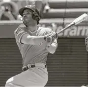  ?? Jayne Kamin-Oncea / Getty Images ?? Jose Altuve connects on his 20th homer of the season, a two-run shot in the first inning of Sunday’s 7-5 Astros victory over the Angels.