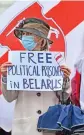  ?? (AFP) ?? A protester holds a placard at a rally against the Belarus leader, on Whitehall, in London