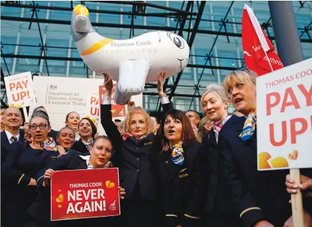 ?? AFP ?? Former Thomas Cook employees call for an inquiry into the travel agency’s collapse during a protest in London.