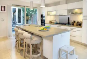  ??  ?? The kitchen area is one of the few places in the house left untouched by Norah in the recent redecorati­on. It was designed by her friend, the interior designer Kari Rocca