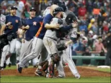  ?? THE ASSOCIATED PRESS ?? The Houston Astros celebrate their 5-4 victory over the Boston Red Sox in Game 4 of the American League Division Series. The Astros wont he series, 3-1, and advanced to the American League Championsh­ip Series.