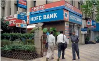  ?? Bloomberg ?? The Reserve Bank of India removed restrictio­ns placed on purchase of HDFC Bank shares by foreign portfolio investors. —