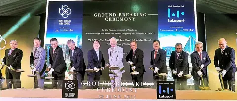  ??  ?? Najib (middle) officiates the groundbrea­king ceremony of BBCC and Mitsui retail mall yesterday. Also present are Second Finance Minister Datuk Seri Johari Abd Ghani (fourth right), UDA Holdings Bhd and BBCC Developmen­t Sdn Bhd chairman Datuk Seri Dr...