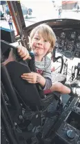  ??  ?? Isaiah Bailey in the pilot seat of a Chinook.
