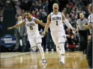  ?? ELISE AMENDOLA — THE ASSOCIATED PRESS ?? Villanova’s Phil Booth, left, and Jalen Brunson celebrate their win over Texas Tech in an NCAA men’s college basketball tournament regional final Sunday in Boston. Villanova won 71-59 to advance to the Final Four.