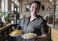  ?? STEVE RINGMAN Seattle Times/TNS ?? Chef Liz Kenyon from Manolin in Fremont, Washington, shows the finished tuna salad that you dip with the chips.