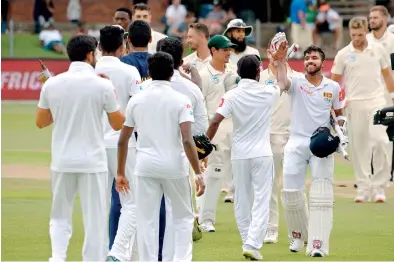  ?? AFP ?? Sri Lanka's man-of-the-match and history-making hero Kusal Mendis greeting teammates after the country’s landmark victory on the third day of the second Test between South Africa and Sri Lanka at St. George's Park Stadium in Port Elizabeth yesterday.