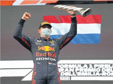  ?? REUTERS ?? Red Bull’s Max Verstappen celebrates on the podium after winning the Emilia Romagna Grand Prix on Sunday.
