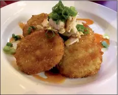  ?? Arkansas Democrat-Gazette/ERIC E. HARRISON ?? Fried Green Tomatoes with Crabmeat & Remoulade are a starter at Maddie’s Place.