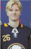  ?? AP PHOTO ?? HE’S THE ONE: Rasmus Dahlin, the No. 1 pick in last week’s NHL draft, poses after being introduced by the Sabres.