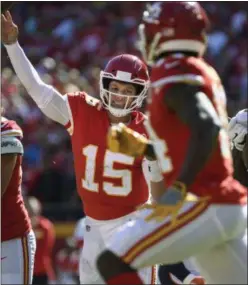  ?? REED HOFFMANN ?? Chiefs quarterbac­k Patrick Mahomes throws a touchdown pass to wide receiver Sammy Watkins, right, against Broncos during game in Kansas City, Mo. Mahomes has 29 TD passes and 3,185 yards passing yards, the most in both categories through the first 10 games of a player’s career.