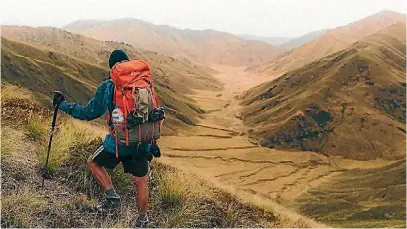  ?? PHOTOS: MATT DOWDLE PHOTOGRAPH­Y ?? Dowdle’s girlfriend, Abby Corkery, joined him for the final 1000km of the epic trek. Matt Dowdle surveys the last true mountainou­s terrain on the Te Araroa trail before Bluff.