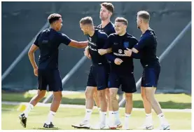  ?? — AP ?? Huddle up: (From left) England’s Trent Alexander-Arnold, Jamie Vardy, Gary Cahill, Kieran Trippier and Jordan Henderson during a training session in St Petersburg yesterday.