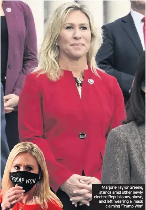  ??  ?? Marjorie Taylor Greene, stands amid other newly elected Republican­s, above, and left wearing a mask claiming ‘Trump Won’