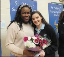  ??  ?? Transition Year student Grainne O’Leary makes a presentati­on to Demi Isaac Oviawe at St. Mary’s on Monday. Photo: Eugene Cosgrove