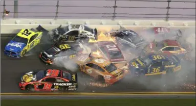  ?? GARY MCCULLOUGH — THE ASSOCIATED PRESS ?? Multiple cars crash in turn 3 during the Daytona 500 on Feb. 17.