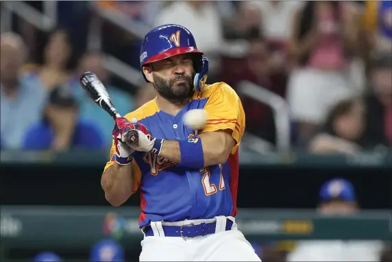  ?? WILFREDO LEE — THE ASSOCIATED PRESS ?? Venezuela’s Jose Altuve is hit by a pitch during the fifth inning of a World Baseball Classic game against the U.S., Saturday, March 18, 2023, in Miami.