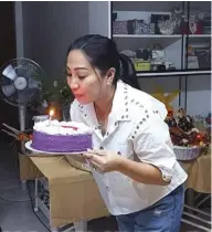  ?? ?? Cathy Yap, the Birthday Celebrator blows out the birthday candle