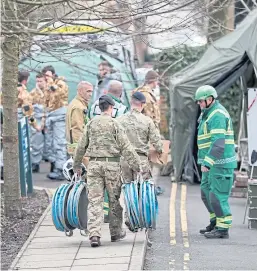  ?? Picture: PA. ?? Internatio­nal intrigue came to Salisbury in March 2018, as police and military personnel gathered outside Bourne Hill police station to probe the suspected nerve agent attack on the Skripals.