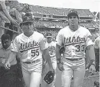  ?? OTTO GREULE JR./ GETTY IMAGES ?? Ozzie, left, and Jose Canseco played for the Athletics in 1990.