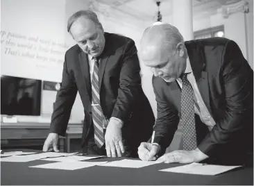  ??  ?? B.C. Green Party Leader Andrew Weaver, left, and B.C. NDP Leader John Horgan sign an agreement in May to create a minority government. Weaver hasn’t let the agreement stop him from criticizin­g the NDP, writes Les Leyne.