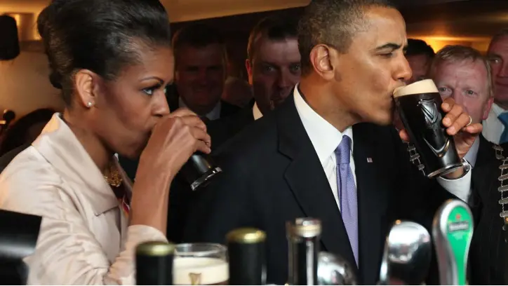  ??  ?? THIRSTY WORK: Michelle and Barack Obama enjoy a drink of Guinness at Ollie Hayes Bar in Moneygall, Co Offaly — the president’s ancestral home — on their previous trip to Ireland in 2011