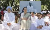  ?? — PTI ?? Former Prime Minister Manmohan Singh, former Congress president Sonia Gandhi and Congress president Rahul Gandhi at a function on the birth anniversar­y of Mahatma Gandhi at Sevagram, Wardha, on Tuesday.