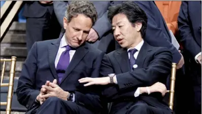  ?? AP ?? U.S. Treasury Secretary Timothy Geithner Fund meeting Saturday in Washington.
(left) speaks with Japan’s Finance Minister Jun Azumi during an Internatio­nal Monetary