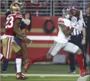  ?? BEN MARGOT — THE ASSOCIATED PRESS ?? Giants wide receiver Odell Beckham Jr., right, catches a touchdown pass in front of 49ers cornerback Ahkello Witherspoo­n in the second half of Monday night’s game.