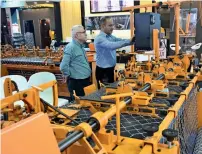  ?? — Photo by Shihab ?? Visitors inspect products at the big 5 internatio­nal building and constructi­on show in Dubai on Monday.