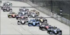  ?? CARLOS OSORIO — THE ASSOCIATED PRESS ?? Alexander Rossi leads the field at the start of the second race of the IndyCar Detroit Grand Prix auto racing doublehead­er, Sunday in Detroit.