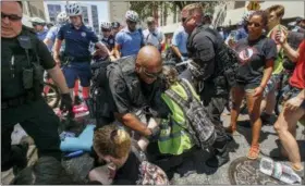  ?? JESSICA GRIFFIN — THE PHILADELPH­IA INQUIRER VIA AP ?? Police confront demonstrat­ors outside the federal Immigratio­n and Customs Enforcemen­t agency on Thursday in Philadelph­ia. Several protesters were arrested.