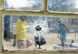  ??  ?? A bullet hole in the window of the house where Lenah and Motlalepul­e Motsatsing were shot dead.