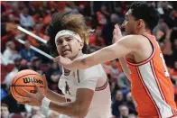  ?? The Associated Press ?? ■ Arkansas’ Anthony Black is fouled by Illinois’ RJ Melendez during the NCAA Tournament Thursday in Des Moines, Iowa.