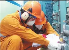  ?? PROVIDED TO CHINA DAILY ?? CNNC employees conduct maintenanc­e work at a nuclear power project in Zhangzhou, Fujian province.