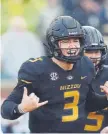  ?? Jamie Squire, Getty Images ?? Missouri quarterbac­k Drew Lock is an intriguing prospect, and the Broncos have noticed.