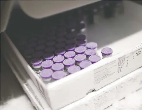  ?? — REUTERS FILES ?? Vials of the Pfizer-BioNTech COVID-19 vaccine are seen in an ultra low temperatur­e freezer. According to Health Minister Adrian Dix, almost 76,000 shots of the vaccine have been administer­ed in B.C.