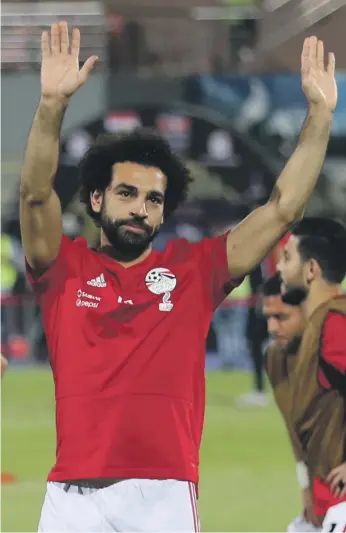  ?? Reuters; Antonie Robertson / The National ?? Egypt’s Mohamed Salah has struggled for form this campaign but former intentiona­l Mido, below, says it would have been ‘impossible’ to repeat last season’s heroics
