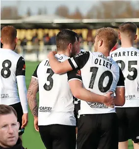  ?? ?? ■ Captain Greg Olley and Robbie Tinkler celebrate victory in the west country. Left, Mike Williamson