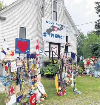  ?? CONTRIBUTE­D • ROSEMARY GODIN ?? A memorial to the 22 people murdered by one person last year in several small Nova Scotia communitie­s was built at a former church building along the main road leading into Portapique, Colchester County last year.