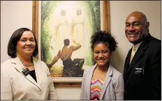  ??  ?? Mission President of Arkansas Taniela Wakolo (right) stands with his wife, Anita Wakolo, (left) and their daughter, Jasmin, at a state mission office. Taniela Wakolo has been called by the church to be a general authority seventy, a position held by...