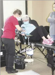  ?? Katie West • Times-Herald ?? Amanda Jones, with the American Red Cross, preps Corinne Eldridge to donate blood. The Red Cross Blood Drive was held Thursday at Forrest City Medical Center yesterday.